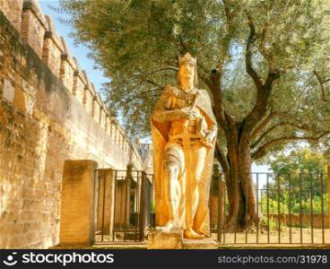 Cordova. Monument to King Alfonso XI.. The sculpture of King Alfonso XI wise at the entrance to the Alcazar. Cordoba. Andalusia.