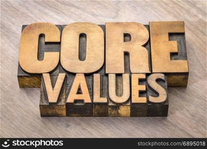 core values banner - word abstract in vintage letterpress wood type blocks against grained wooden background