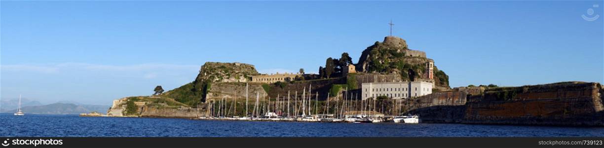 CORFU, GREECE - CIRCA MAY 2019 Panorama of marina and Old fortress