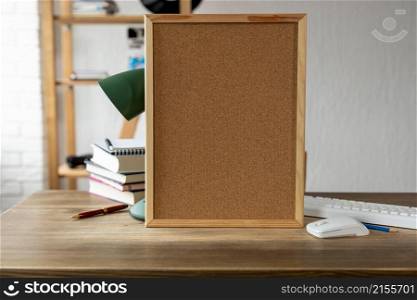 Cork board frame background at table in office. Student home workplace