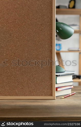 Cork board frame background at table in office. Student home workplace