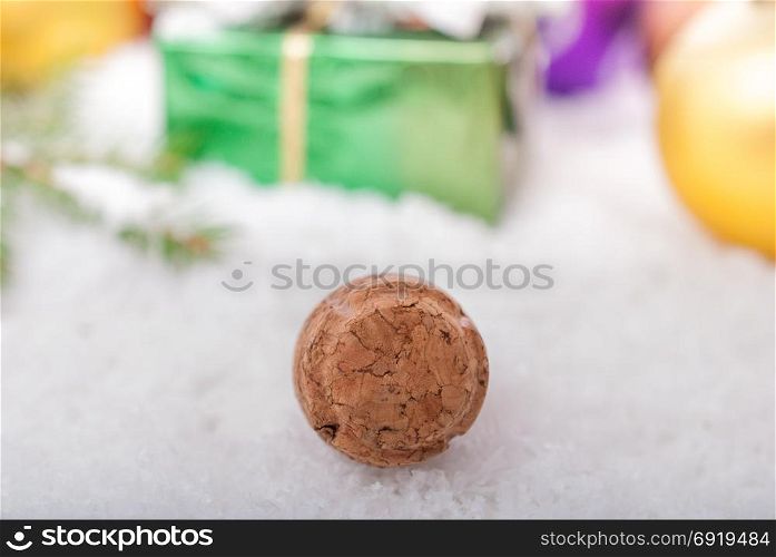 Cork from champagne closeup on a blurred background of Christmas decorations