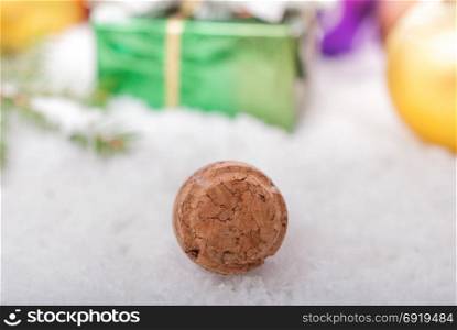 Cork from champagne closeup on a blurred background of Christmas decorations