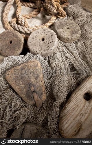 Cork, rope and net on wooden background