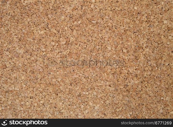 Cork sheet photographed up close. Exactly you can see the structure of cork and a single, irregular elements. Ideal as a background and texture.Brown cork.Horizontal view.