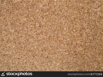 Cork sheet photographed up close. Exactly you can see the structure of cork and a single, irregular elements. Ideal as a background and texture.Brown cork.Horizontal view.