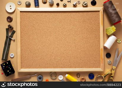 corkboard with tailor or sewing accessories and supplies tools, creative concept top view