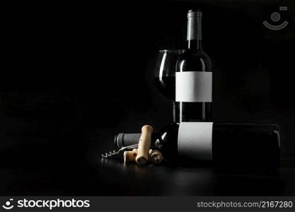 corkscrew corks near bottles wineglass