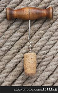 corkscrew on the background of hemp rope