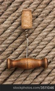 corkscrew on the background of hemp rope
