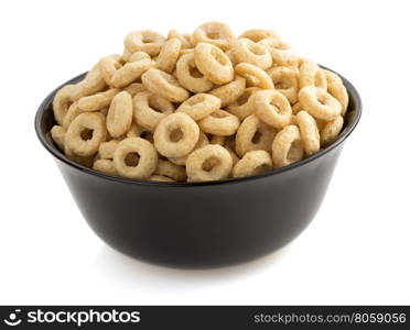 corn flakes rings in bowl isolated on white background