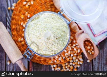 corn flour in glass bank and on a table