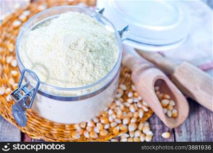 corn flour in glass bank and on a table
