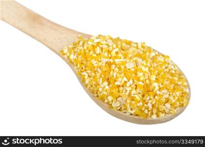 corn grits on wooden spoon, isolated on a white background