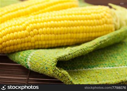corn lying on a bamboo mat