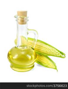 Corn oil in a glass decanter with two ears of corn isolated on white background