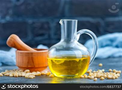 corn oil in bottle and on a table