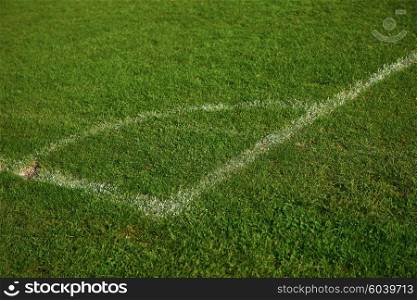 Corner of the soccer field green grass background