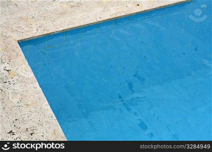 corner of the swimming pool with blue water