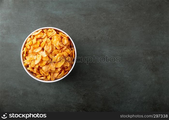 Cornflakes in a bowl on a nice underground, top view