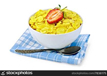 Cornflakes in a white bowl on a napkin, strawberries, spoon isolated on white background