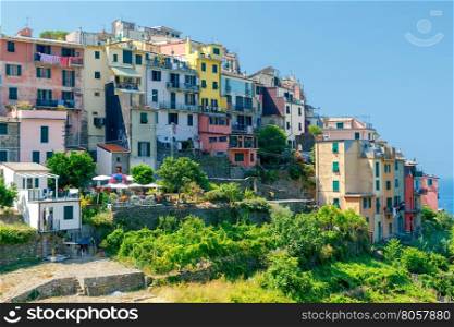 Corniglia. Old Italian village.. View of the colorful houses facades of the traditional medieval Italian village Corniglia. Cinque Terre. Italy.