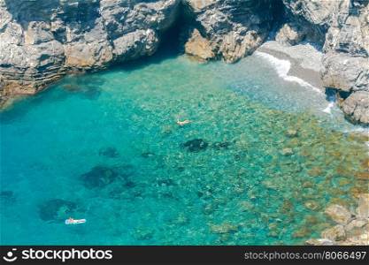 Corniglia. Public Beach.. Small pebble beach with crystal clear water near the village of Corniglia. Cinque Terre. Liguria.