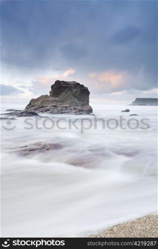 Cornish seascape shot in twilight. Motion blur in water.