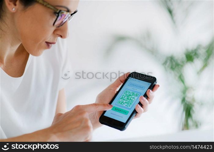 Corona Virus App. Woman Holding Smartphone with Application for Checking Health Status for COVID19.