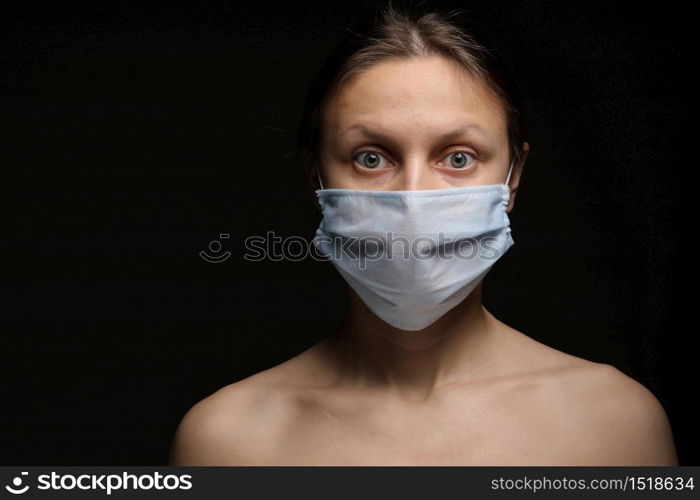 coronavirus, a girl in a mask on a black background. Title about the outbreak of the corona virus, illness. Epidemic. coronavirus, a girl in a mask on a black background. Title about the outbreak of the corona virus, illness. Epidemic.