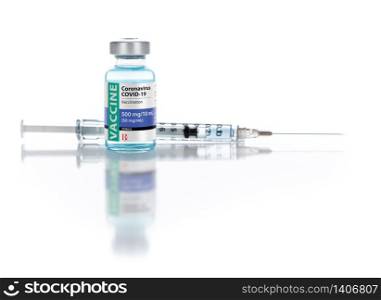 Coronavirus COVID-19 Vaccine Vial and Syringe On Reflective White Background.