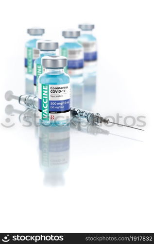 Coronavirus COVID-19 Vaccine Vials and Syringe On Reflective Surface.