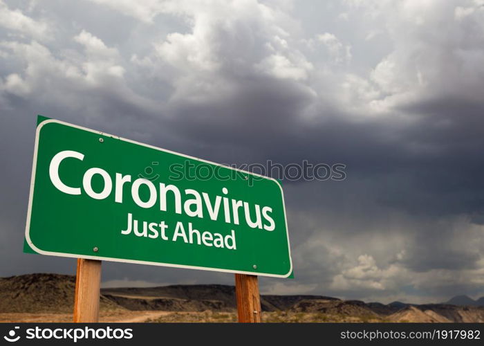 Coronavirus Green Road Sign Against Ominous Stormy Cloudy Sky.