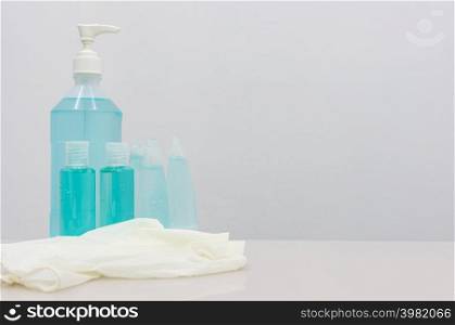 Coronavirus Prevention Equipment, Medical Surgical Mask Hand sanitizer and Medical gloves on the white table, blank space for adding a campaign message to prevent the spread of disease to others.. Coronavirus Prevention Equipment
