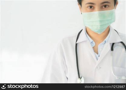 Coronavirus stop infection. young female doctor or intern wearing protective mask and stethoscope against infectious diseases and flu. Healthcare, medical education, emergency medical service, surgery concept