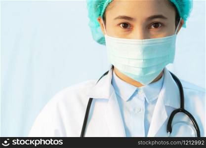 Coronavirus stop infection. young female doctor wearing mask with stethoscope against infectious diseases and flu. Healthcare concept