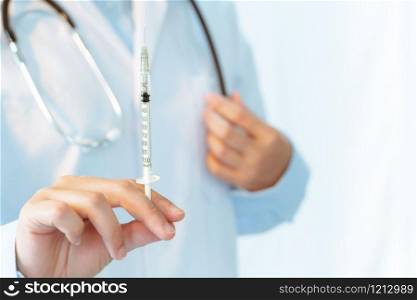 Coronavirus stop infection. young female doctor with syringe and stethoscope against infectious diseases and flu. Healthcare, medical education, emergency medical service, surgery concept