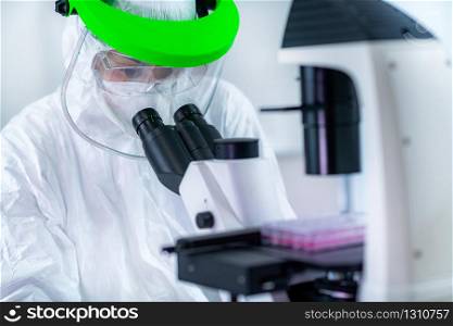 Coronavirus Vaccine Research. Scientist in Protective Suit Researching Virus Antibodies, Developing a Vaccine