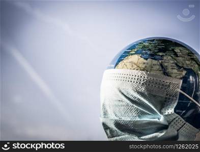 coronavirus world alert - surgical mask on globe