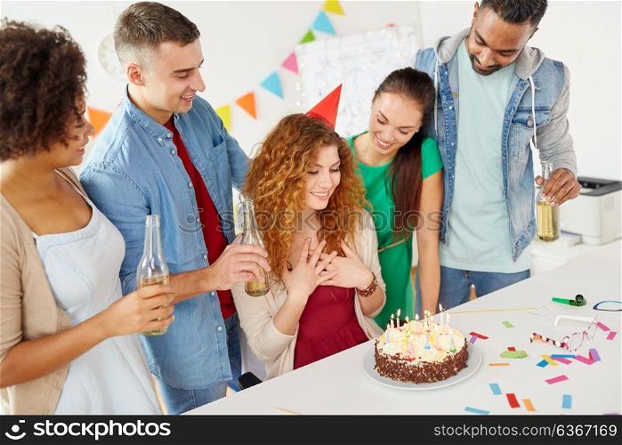 corporate and people concept - happy team of coworkers with non-alcoholic drinks and cake celebrating birthday at office party. happy coworkers with cake at office birthday party