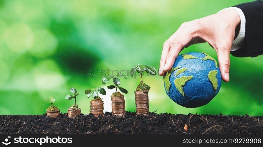 Corporate business invests in environmental subsidies with seedlings growing on coin stack for natural awareness. Eco subsidized growth investment for environment protection and clean energy. Alter. Corporate business invests in environmental subsidies with coin stack. Alter