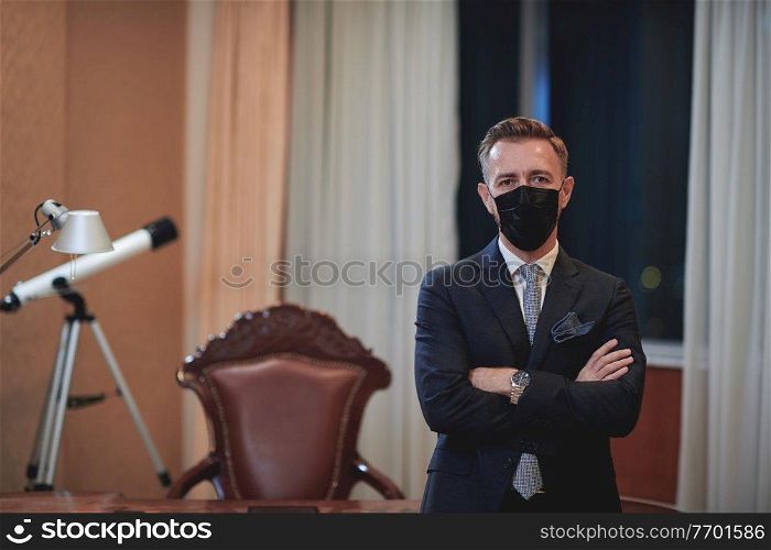 corporate business man wearing protective medical face mask at luxury office