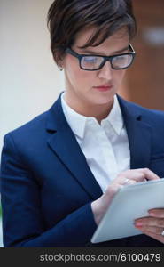 corporate business woman working on tablet computer at modern office interior