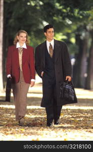 Corporate Couple Walking in Park