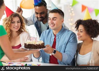 corporate party and people concept - happy team with cake and non-alcoholic drinks celebrating colleague 21st birthday at office party. team greeting colleague at office birthday party