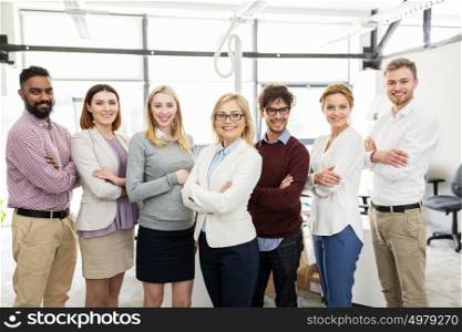 corporate, teamwork and people concept - happy business team in office. happy business team in office