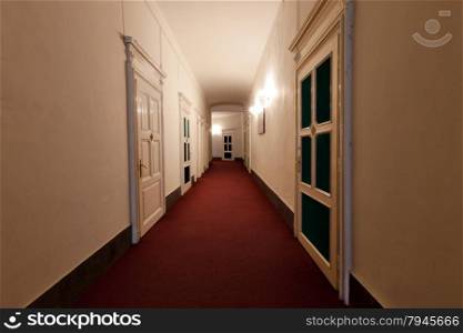 corridor in hotel with rooms entrances on both sides