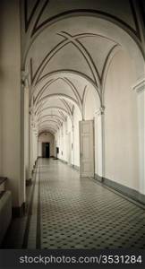 corridor in old vintage building with arch