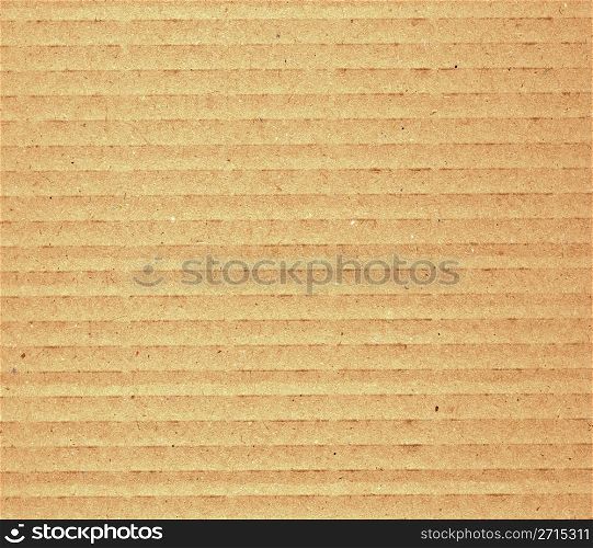 Corrugated cardboard. Brown corrugated cardboard sheet useful as a background