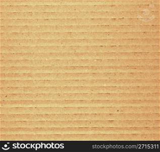 Corrugated cardboard. Brown corrugated cardboard sheet useful as a background